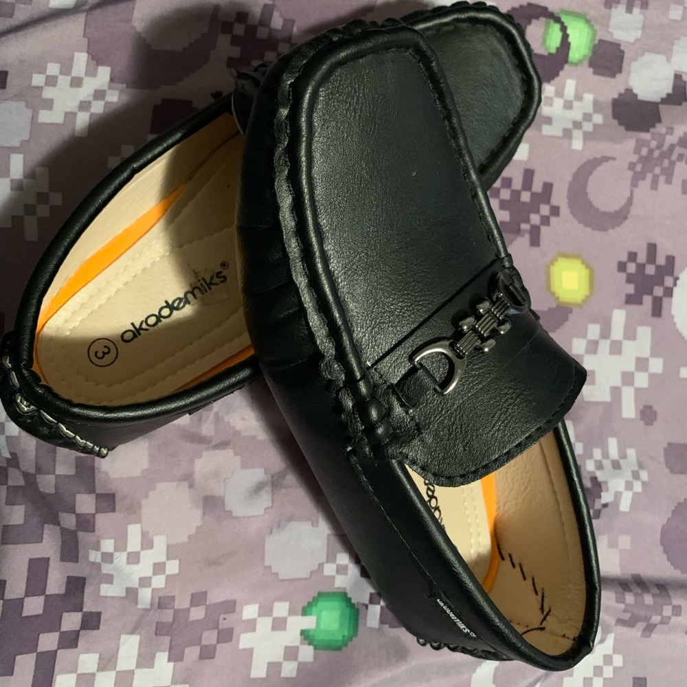 Black classic slip on loafers.